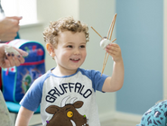 A child in a Gruffalo t-shirt