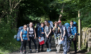 A group of young people setting off hiking.