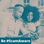 Couple looking at a mobile phone. #ScamAware