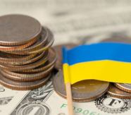 coins and a Ukrainian flag