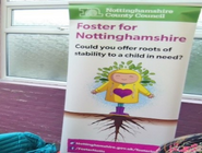 A fostering roll up banner at a pop up event