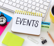 The word 'events' written on a desk