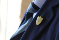 Close up of a school blazer and tie