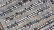 Aerial photo of an outdoor car park full of parked cars