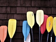 A row of colourful paddles