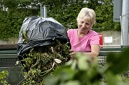 Woman using a recycling centre