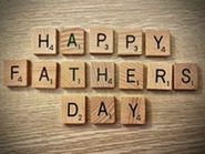 Scrabble tiles spelling out Happy Father's Day 