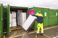 Man recycling electrical items at a recycling centre