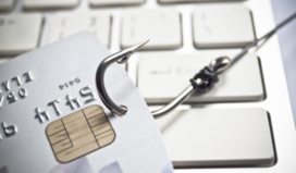 Photo of a bank card with a fish hook attached to the corner