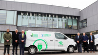 Rushcliffe Borough Council staff and an electric vehicle outside Rushcliffe Arena
