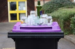 Image of purple recycling bin for glass
