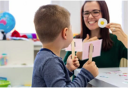 Stock image of a child in a speech therapy session