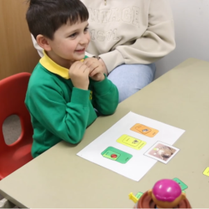 Charles in a speech and language session