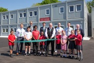 Councillors and pupils cutting the ribbon at St Peters Junior School