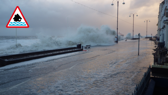 This photo shows impacts expected for a Flood Warning – significant waves and spray on the coast, and flooding of homes is expected.