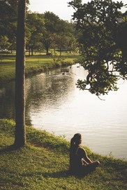 Woman peers out over lake