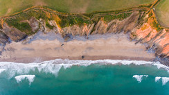 Aerial shot looking down at coastal cliffs