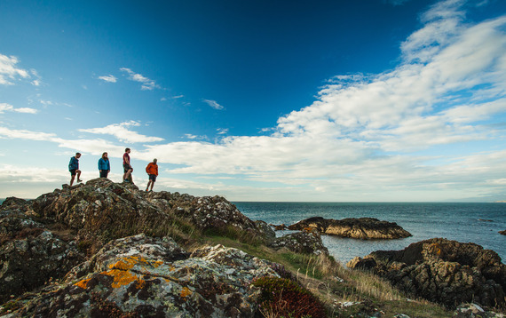 people standing at the coast