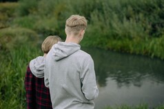 Teenagers looking at a river