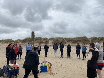 Teachers take part in a training course on the beach