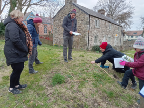 Teachers do a quadrat to count wildflower numbers