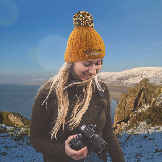 woman wearing a warm hat in a wintery scene