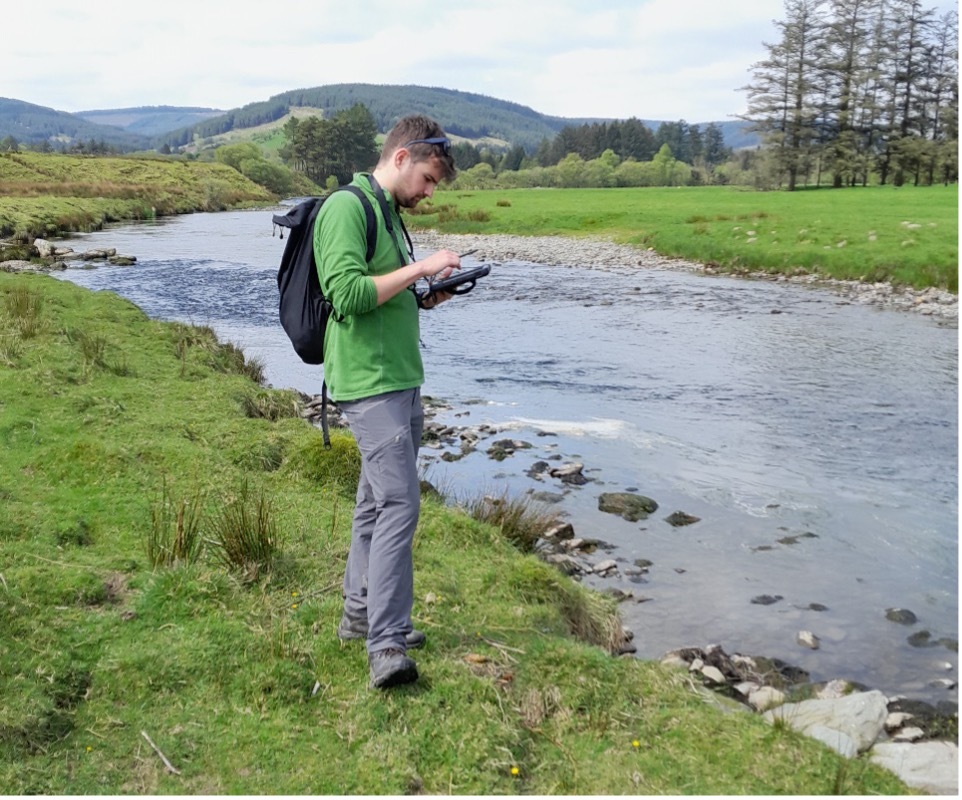 Photo - One of the survey team on the Wye 