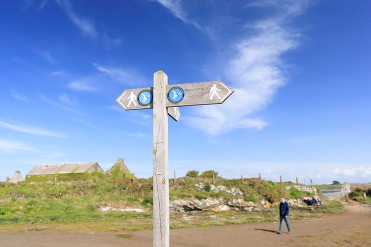 signpost for Anglesey Coastal Path at Cemlyn Bay
