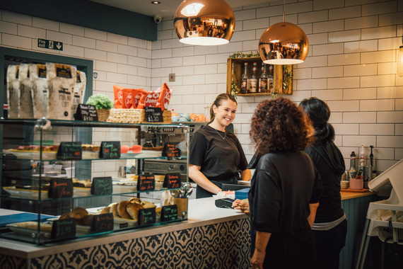 two women being served in a cafe