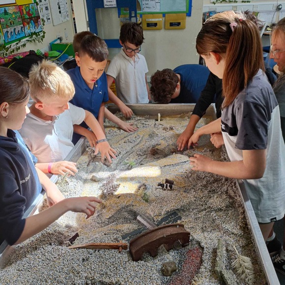 Llanfaes CP School pupils with the river table (credit BNPA)