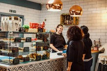 2 people being served in a cafe