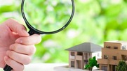 Magnifying glass on houses