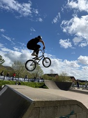 Extreme wheels - boy riding BMX bike