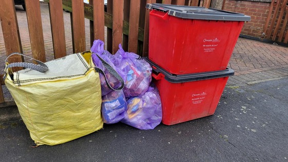 red recycling boxes, yellow bag and purple bag
