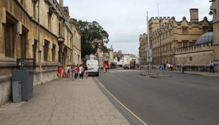 Image of Oxford High Street looking towards the east end. An air quality monitor is visible at the left side. 