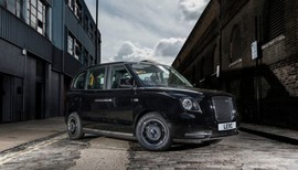 Image of an electric black taxi. 
