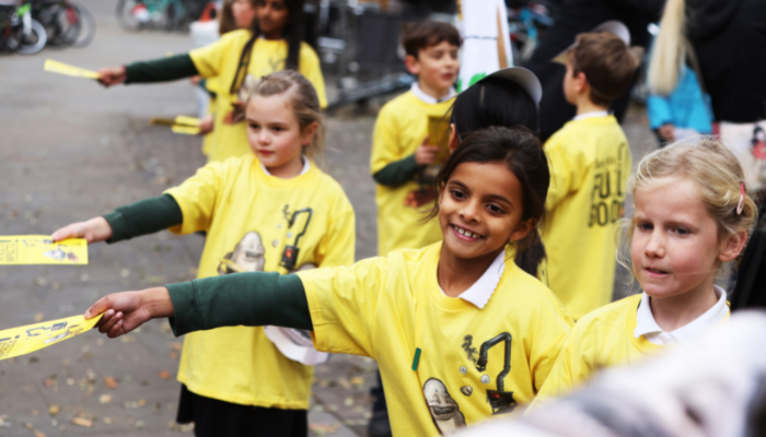 Children from Windmill School handing out Fuel Good leaflets 