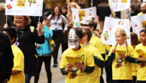 Children from Windmill School marching and handing out Fuel Good leaflets