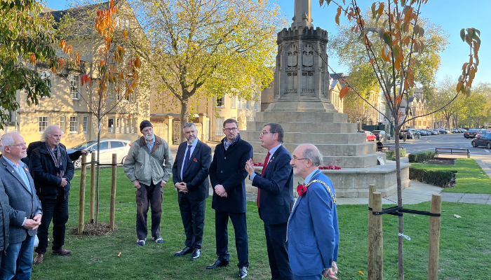 Oxford Lord Mayor and guests from Bonn stand between cherry trees planted beside St Giles' War Memorial 