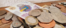 A £20 note and some coins