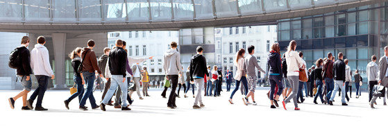 People milling around going about their day in an urban setting