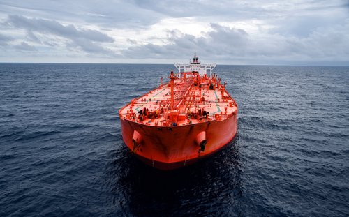 Image of a tanker sailing across a dark ocean