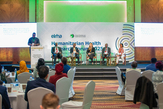 Photo of Etse Yawo sitting on a panel at the Humanitarian Health Research Forum 