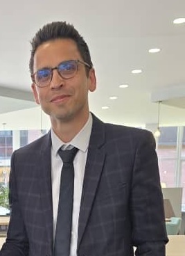man in suit wearing glasses
