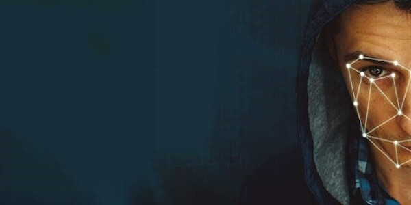 A grid of white lines superimposed over a man's face