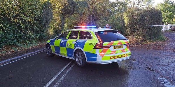 Essex Police roads policing car forming a cordon at the scene in Stock