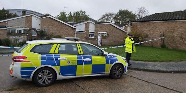 Police car, officer and cordon tape at Whitehouse Meadows, Leigh-on-Sea