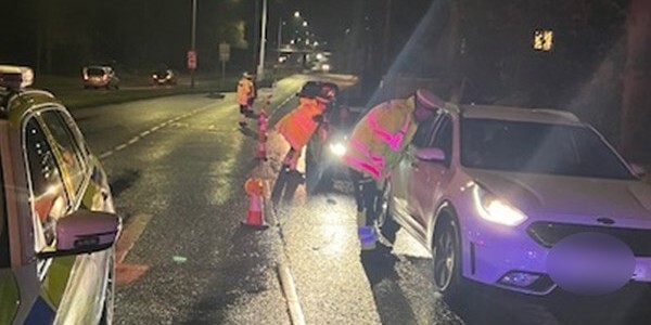 Officers stopping drivers at night