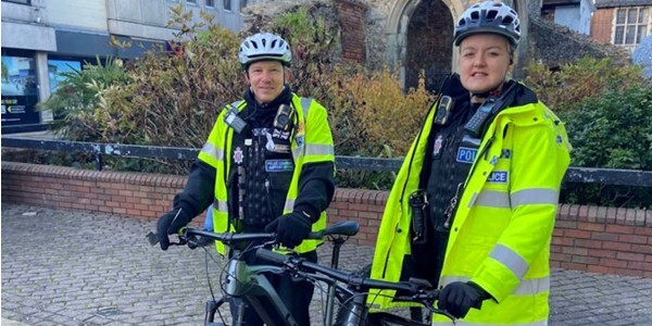 PCSO Adam Dixon-Peters and PC Madeline Payne with their e-bikes on patrol in Brentwood.