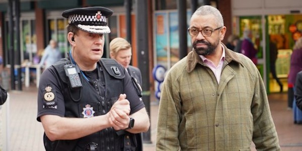 Chief Constable Ben-Julian Harrington walking with James Cleverly MP